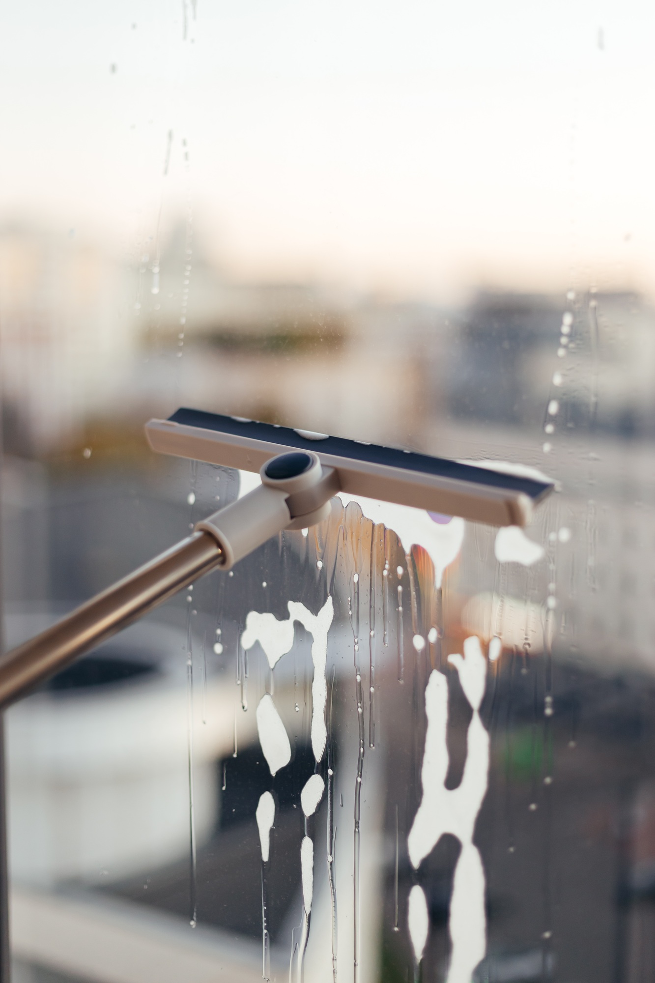 Window cleaning brush for windows. Washing windows with a window brush